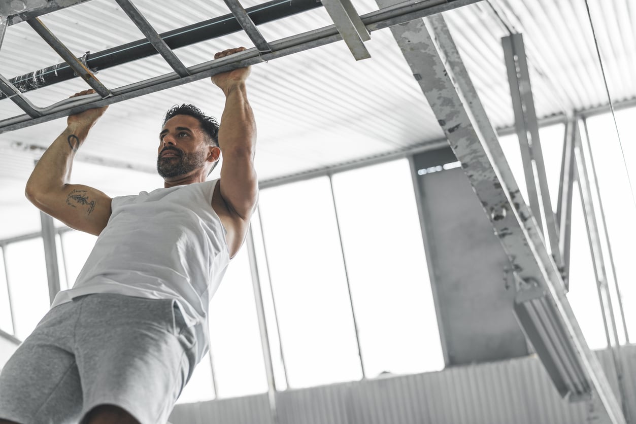 Athletic Man Exercising in a gym