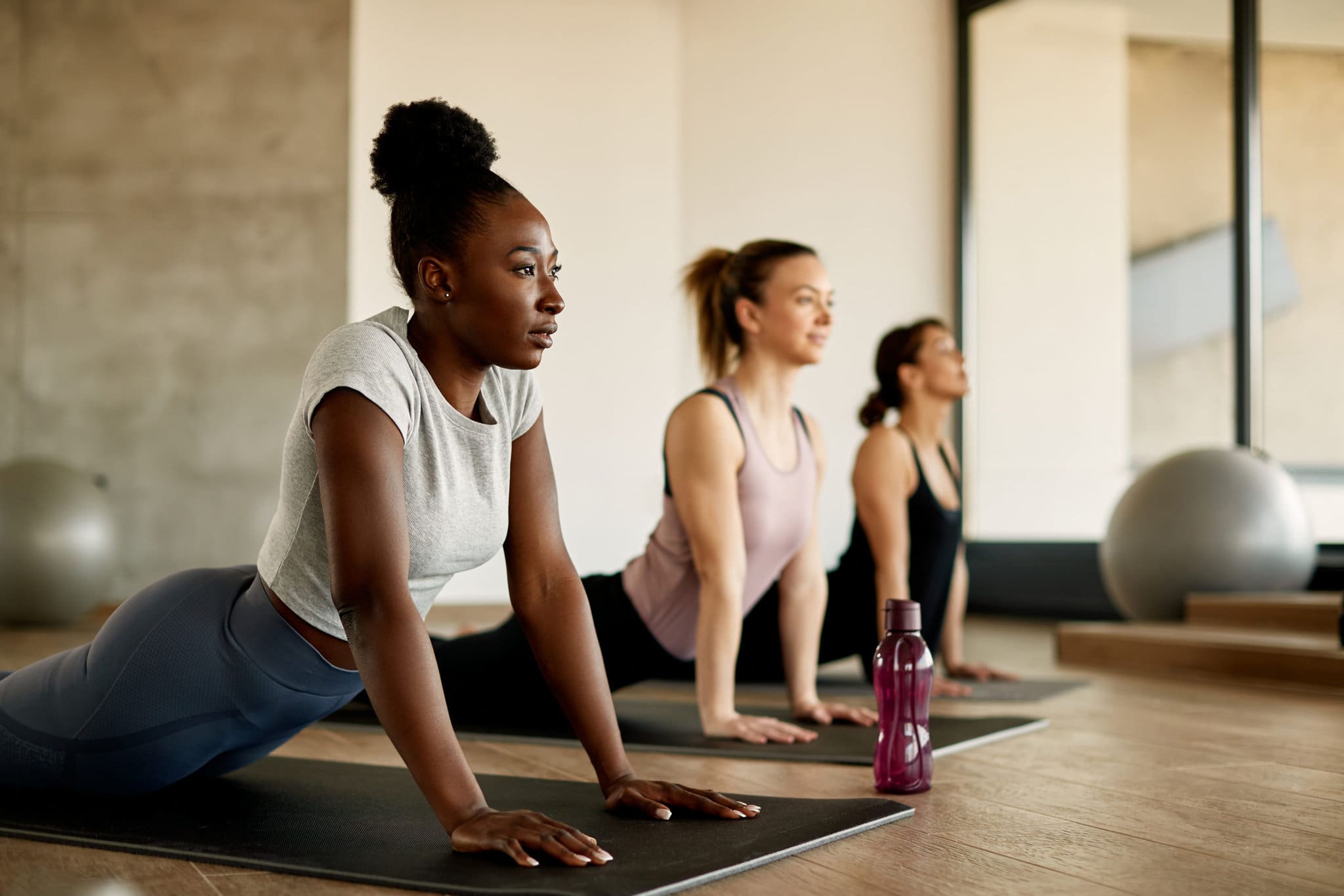 Athletic women doing yoga