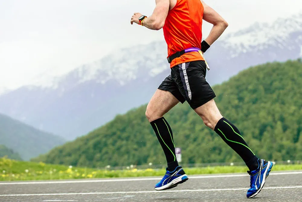 man running with calf sleeves